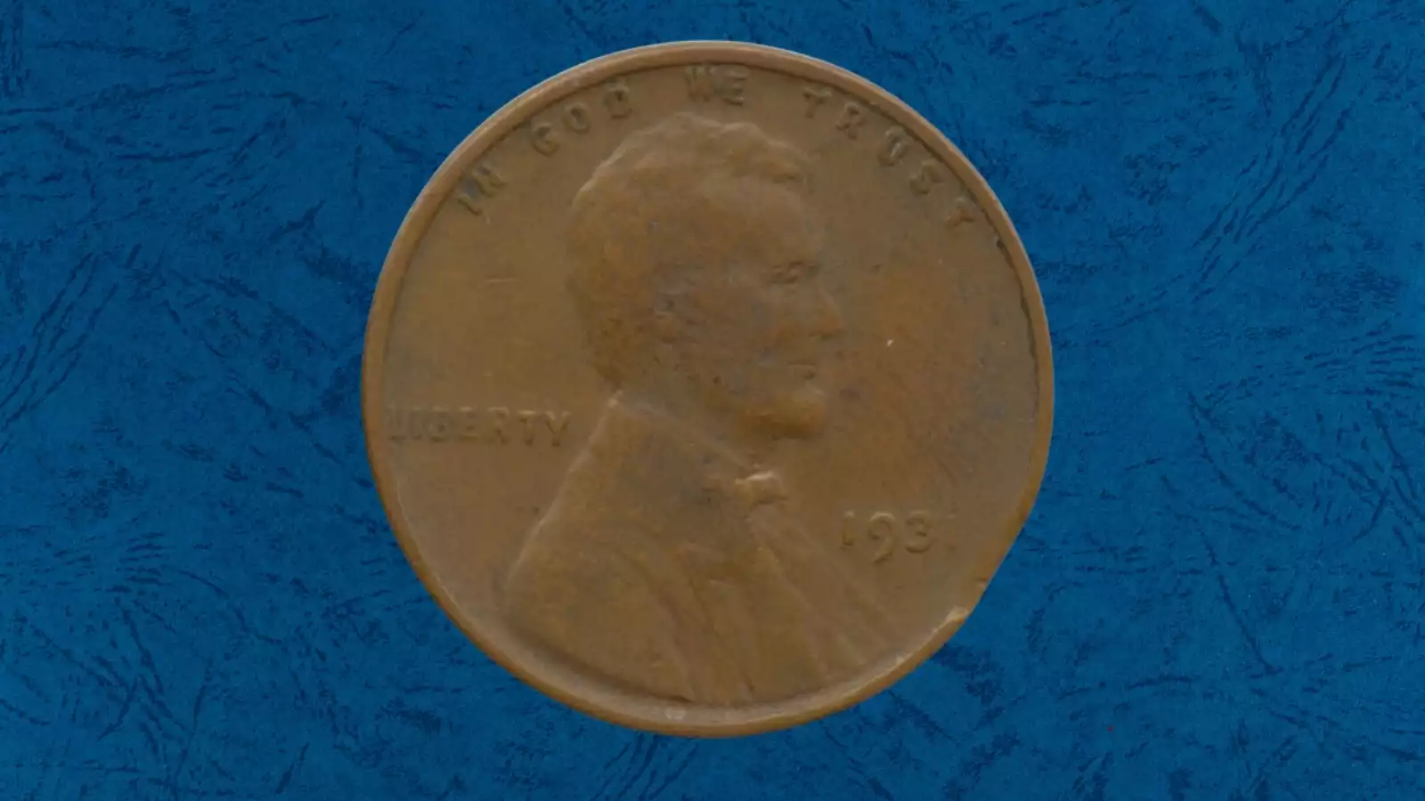 1931 wheat penny off-center strike error showing partial design and exposed planchet crescent